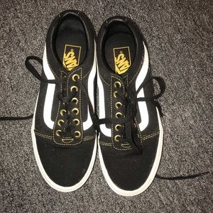 Black Vans with gold linings